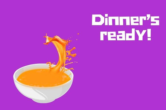 A bowl of tomato soup splashing against a purple background. Text reads: Dinner's ready.